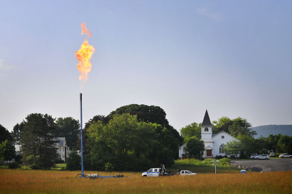 Gas well / flare and church in Farragut